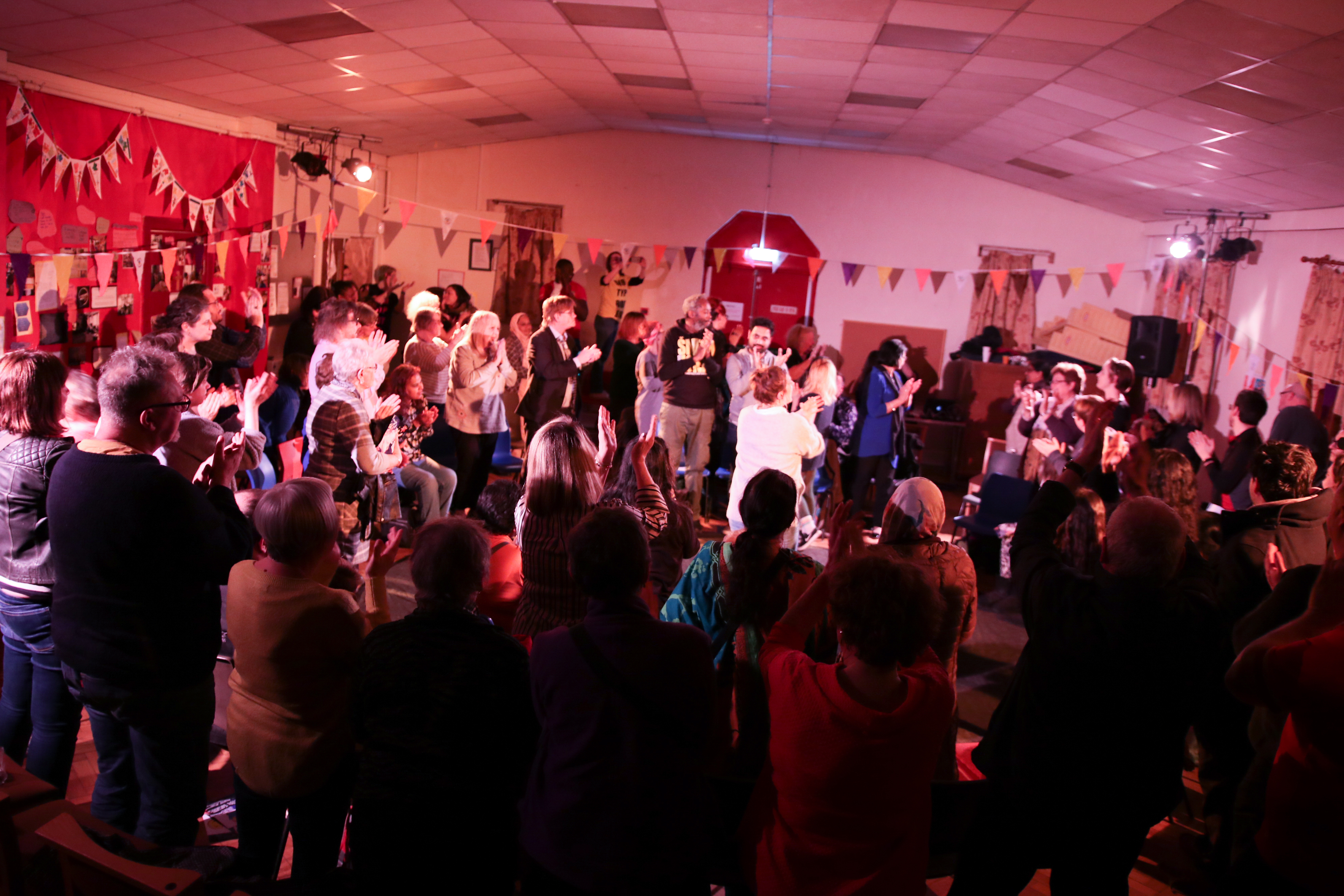 audience standing clapping