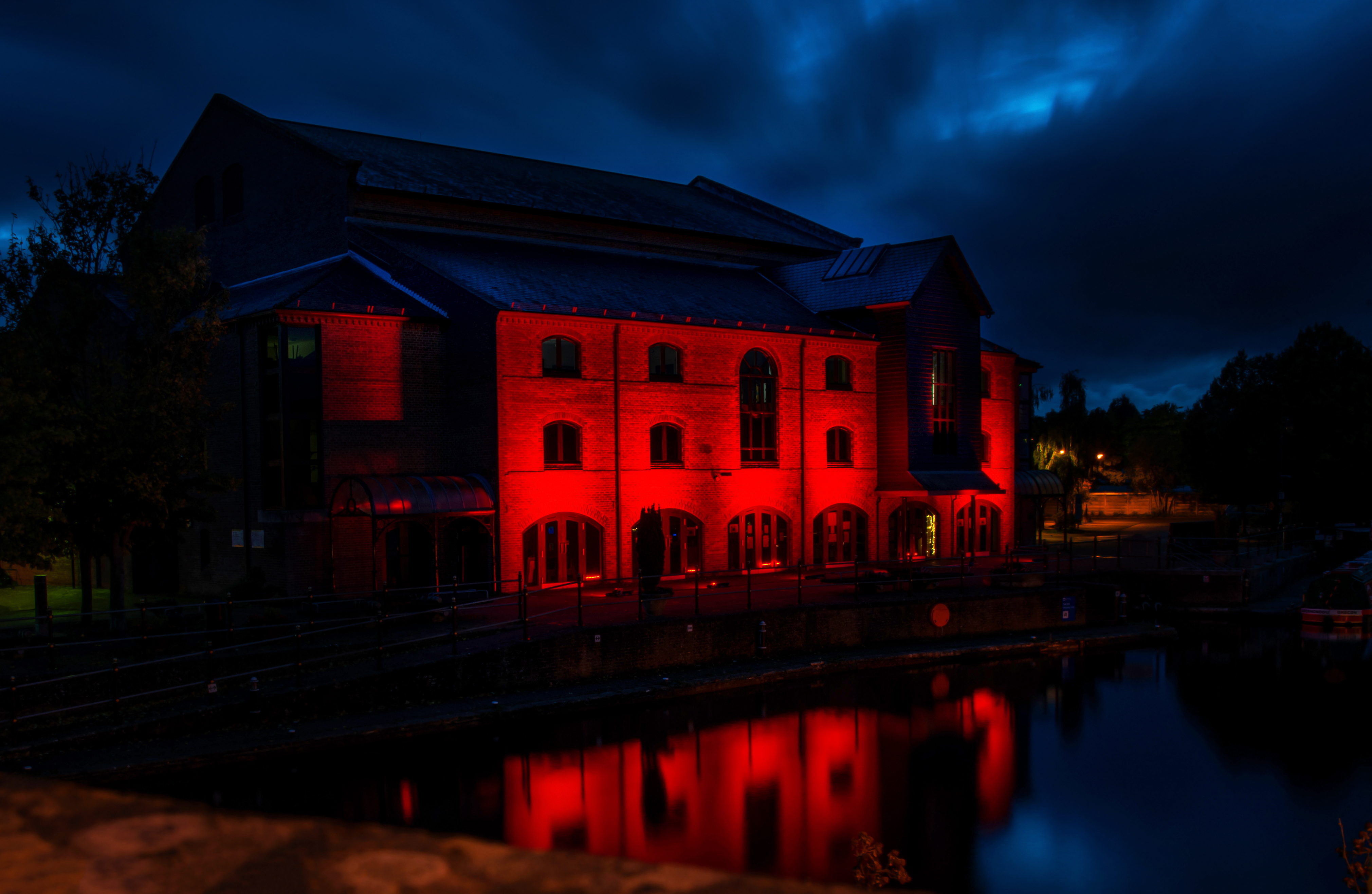 External image of Theatr Brycheiniog lit up in red