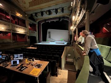 Image of inside a theatre during a technical rehearsal