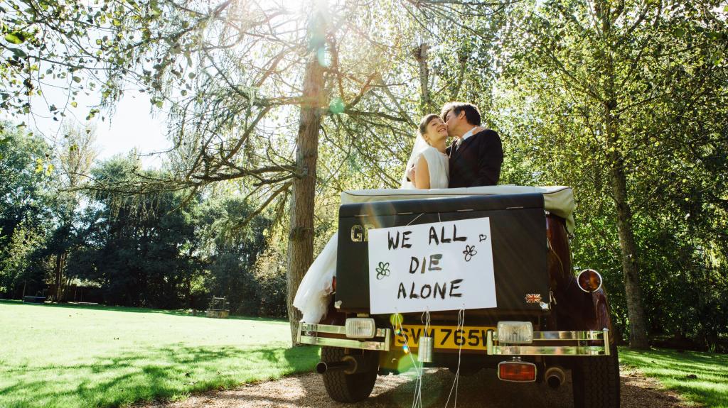 Married couple hugging in car