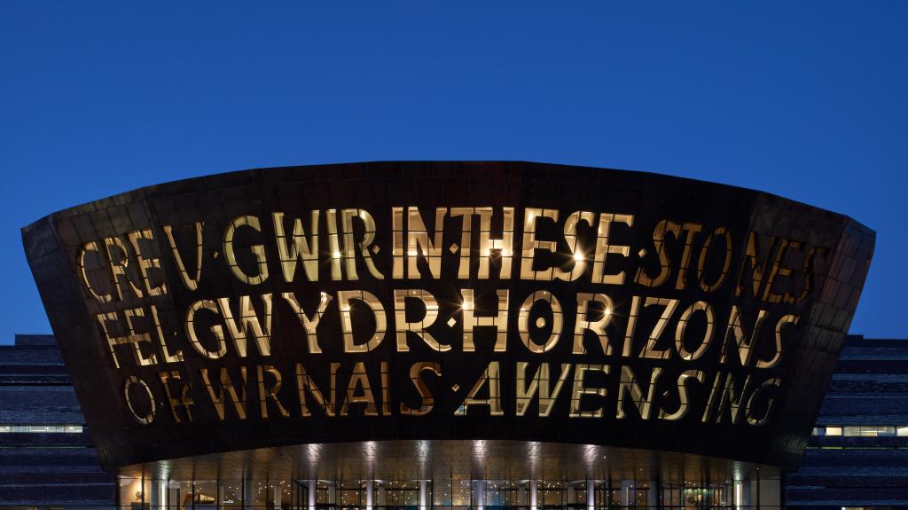 Image of Wales Millennium Centre theatre building with a blue sky