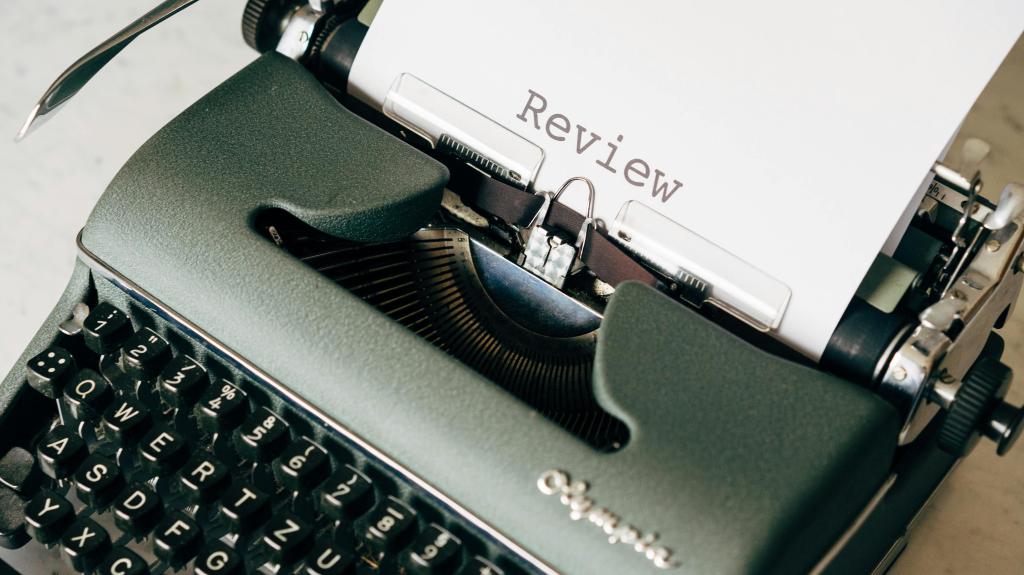 A typewriter with the word review on paper coming out of it.