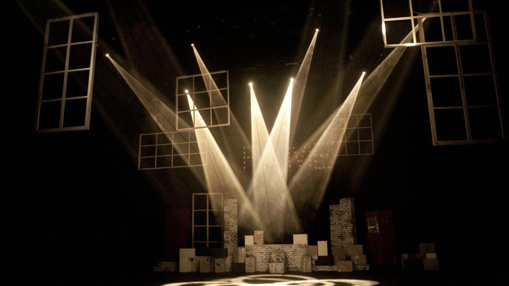 Image of a set on stage with stage light shining down on the set